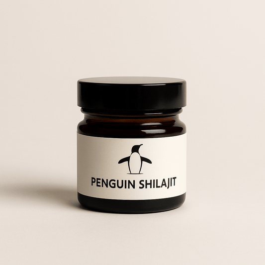 Jar of Penguin Shilajit with a black lid on a beige background